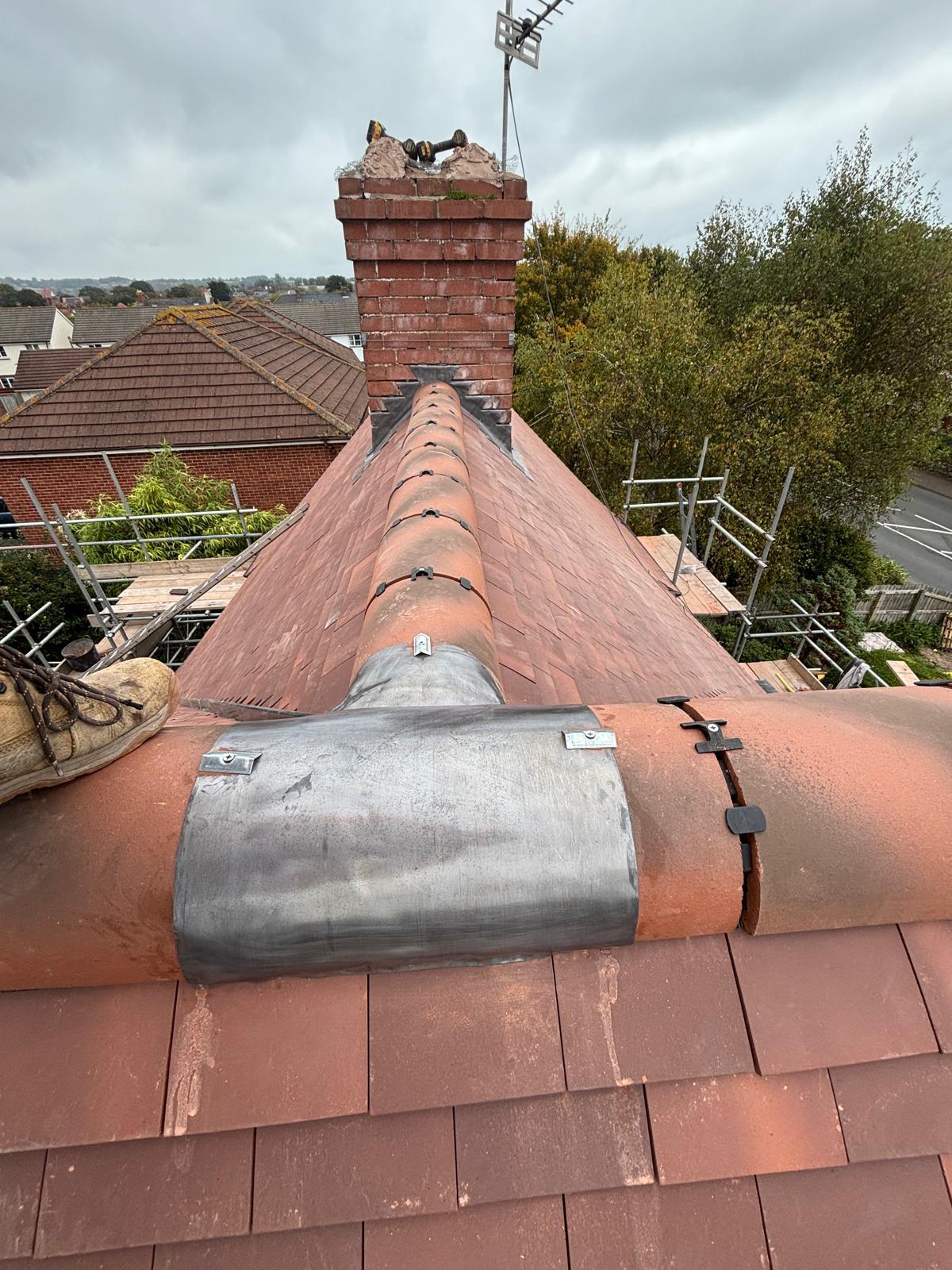 Chimney rebuild with new lead flashing and clay ridge tiles