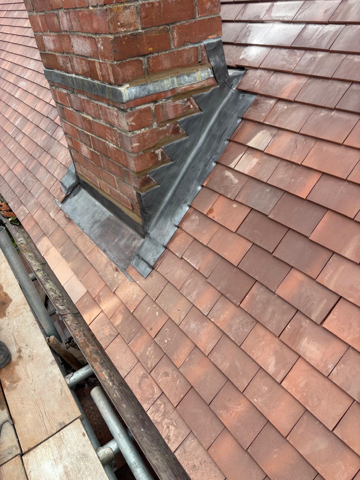 Chimney with fresh Code 4 lead flashing, soakers and stepped apron