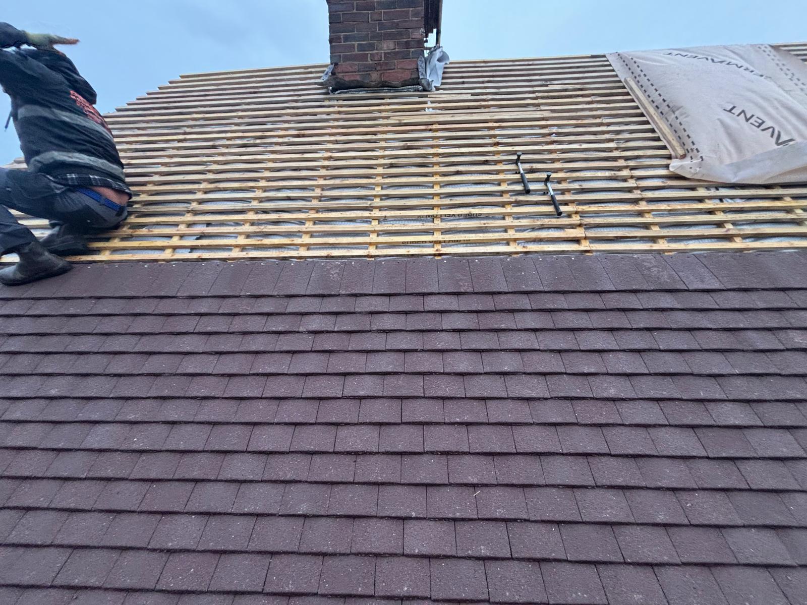 Re-roof in progress — new battens and breathable membrane laid to chimney